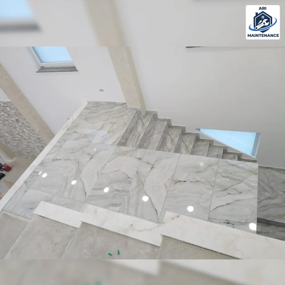 Marble staircase with landing, mid-install.