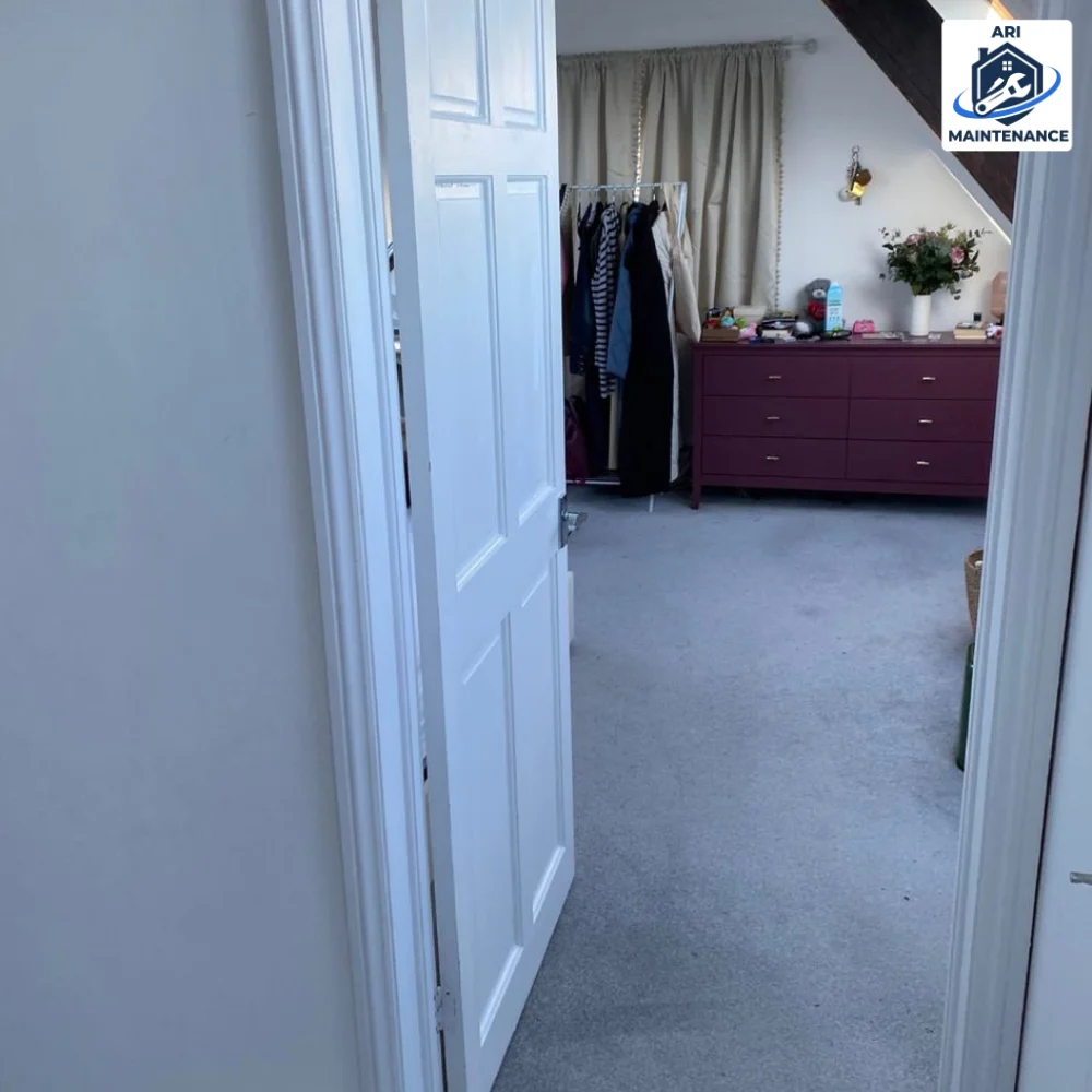 Refurbished children's bedroom doorway view with chest of drawers.