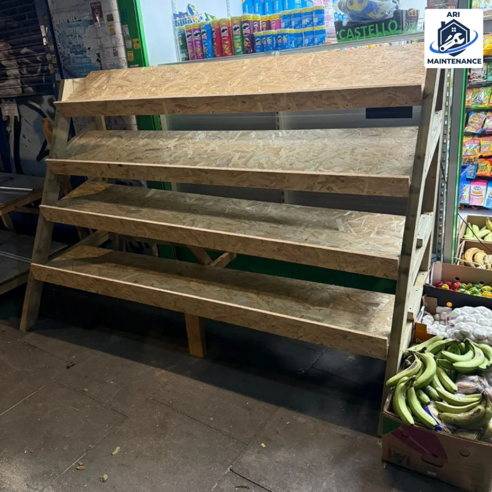 Bespoke indoor market tiered produce rack — custom carpentry.