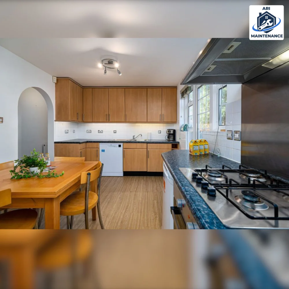 Refurbished kitchen close-up of gas hob with blue tile splashback.