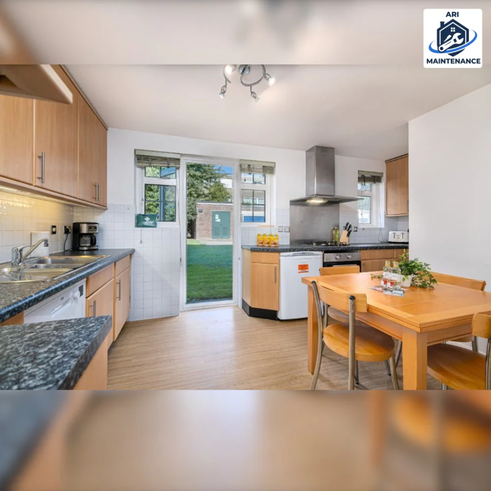 Refurbished kitchen with wooden cupboards opening to garden.