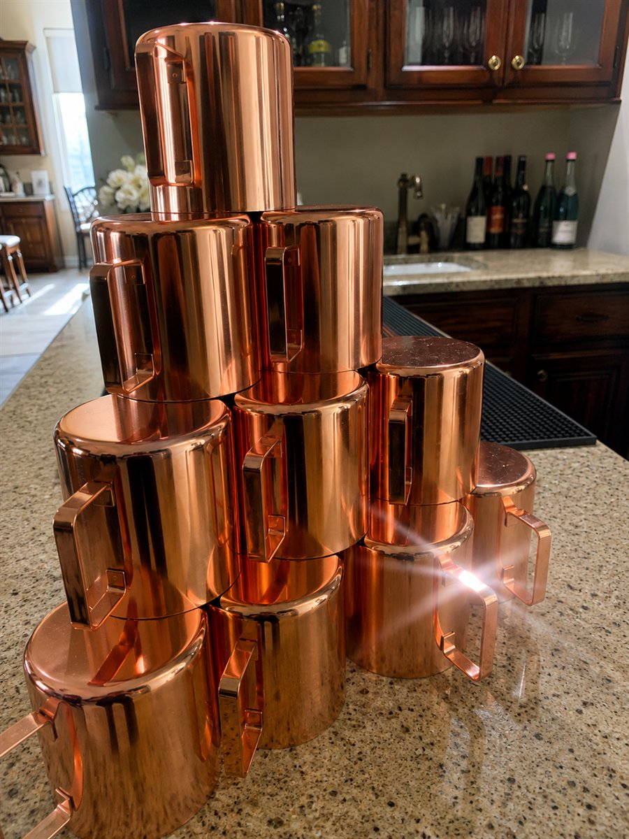 Copper mule mugs arranged for bar service