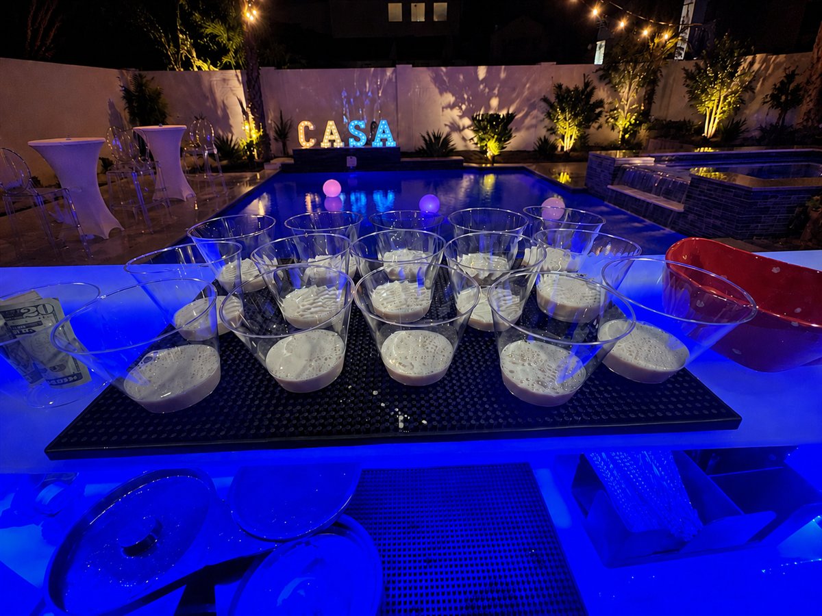 Prepared drinks at an evening poolside celebration