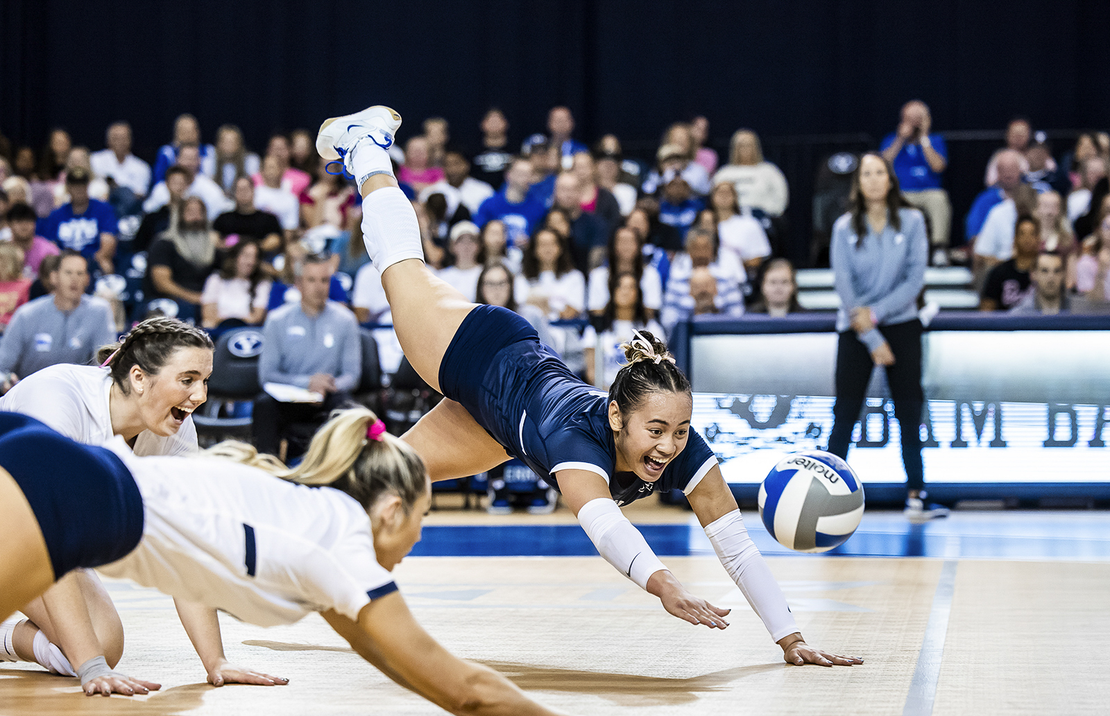 BYU volleyball dig action shot