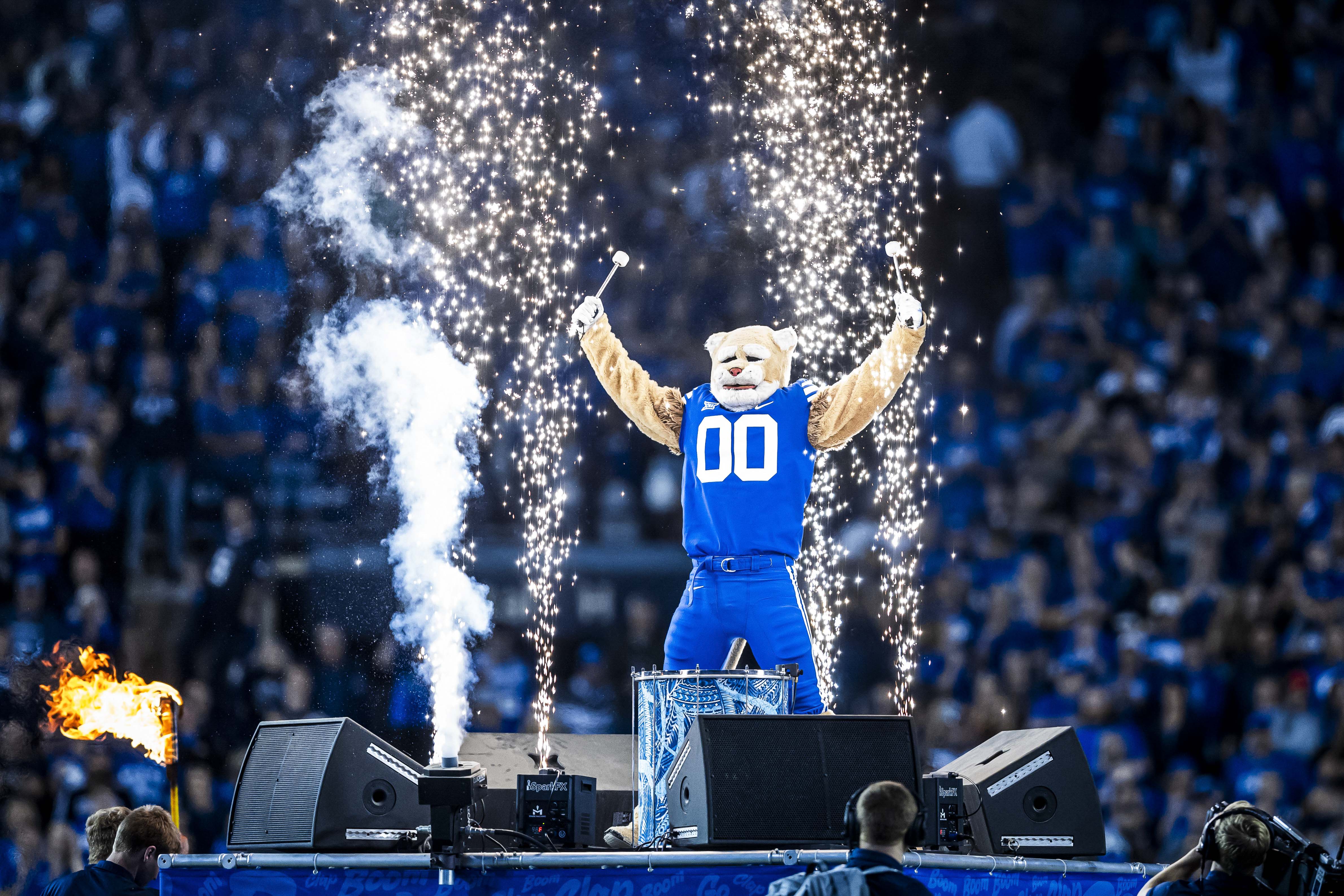 BYU Cosmo mascot with pyrotechnics