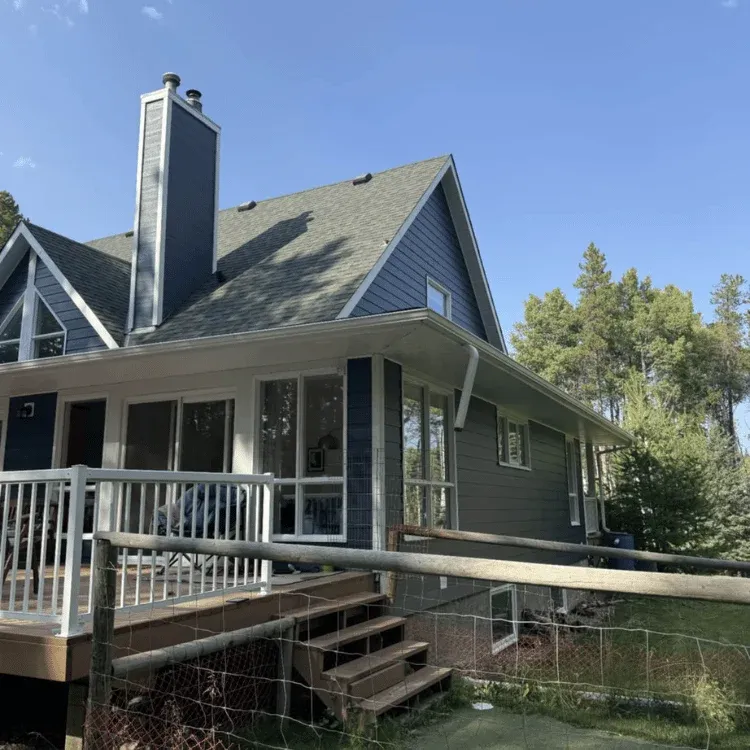 roofing contractor repairing storm damaged shingles in Calgary