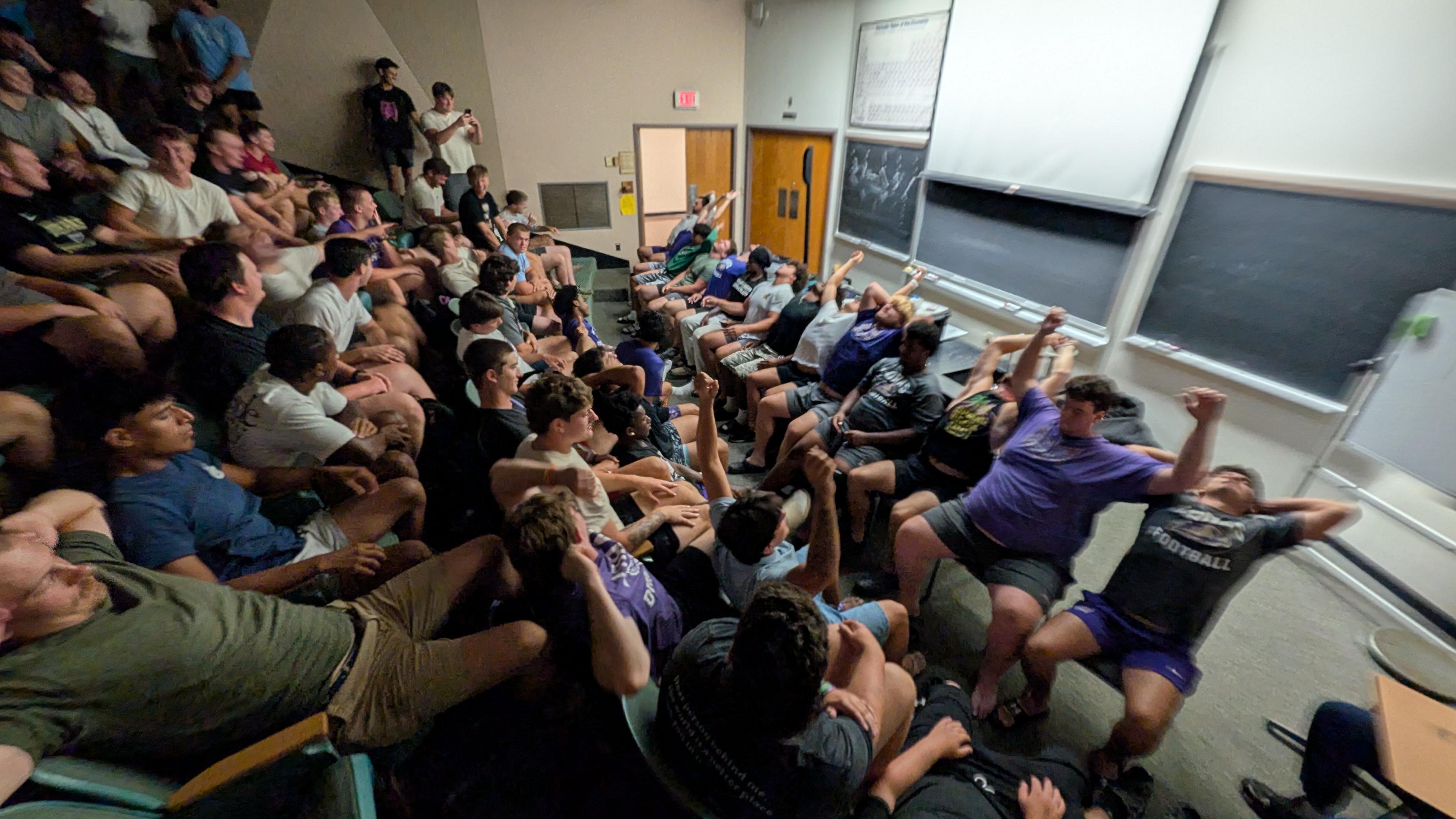 Randy Andrews performing a comedy hypnosis show for the Loras College football team