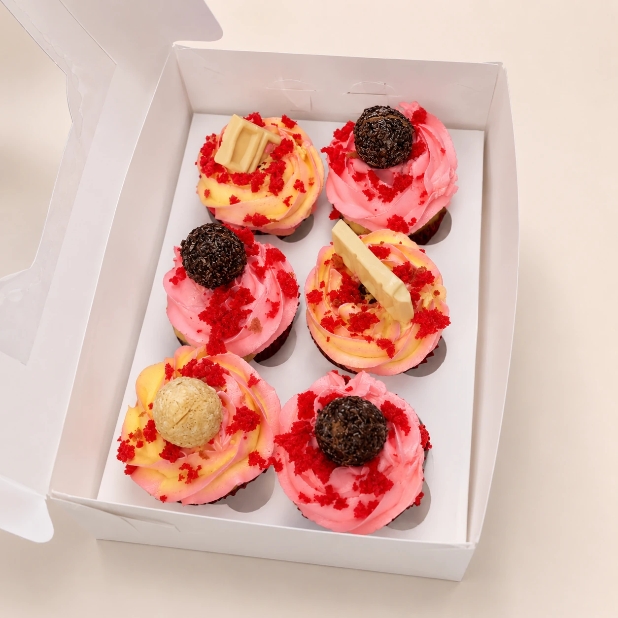 Assorted celebration cupcakes with colourful frosting and toppings