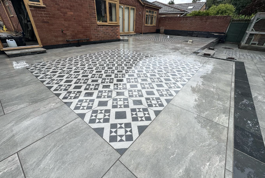 Contemporary patio with dining area in a Staffordshire garden