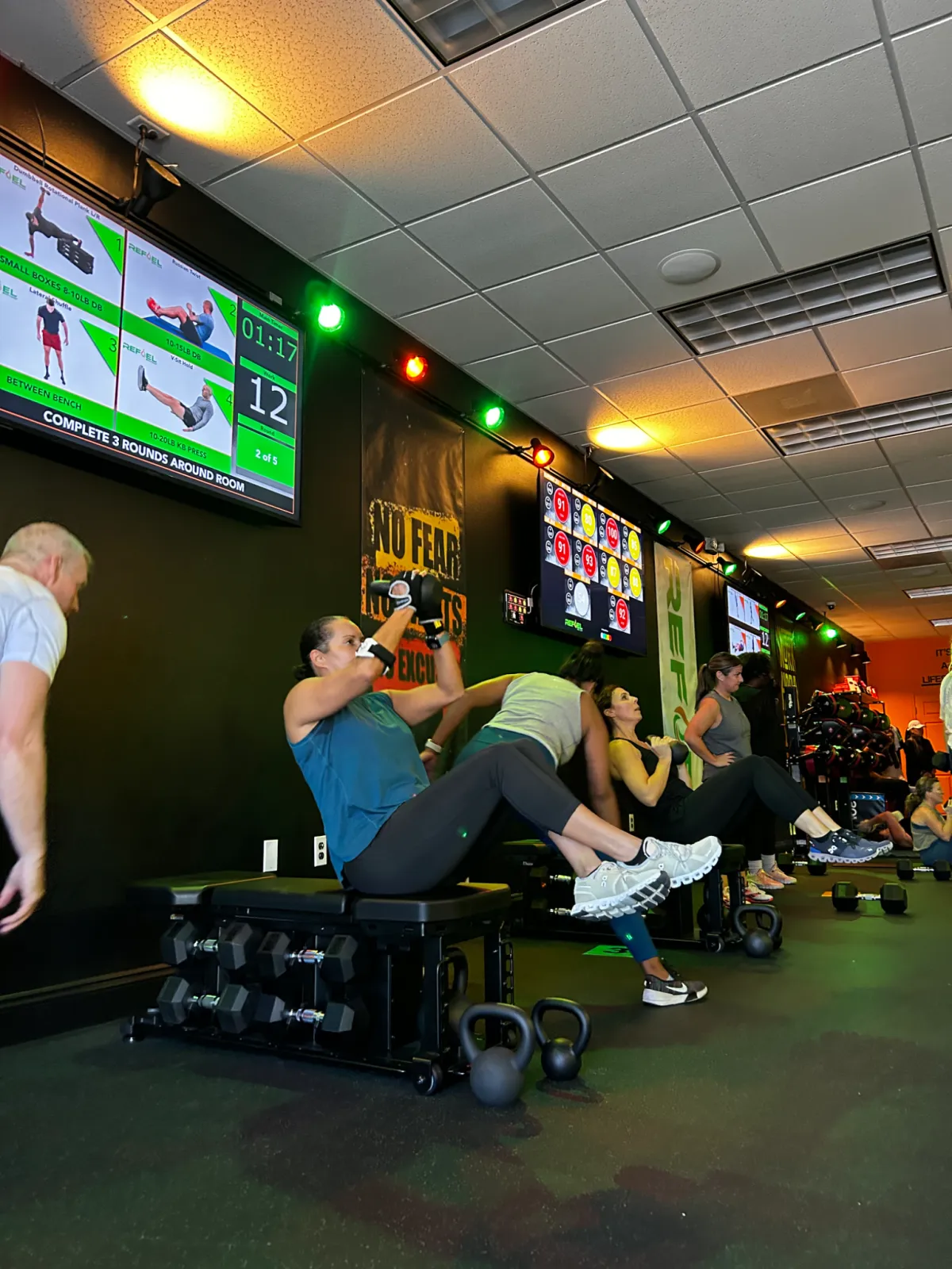 Group class working through a bench circuit at REFUEL Bootcamp Crestview