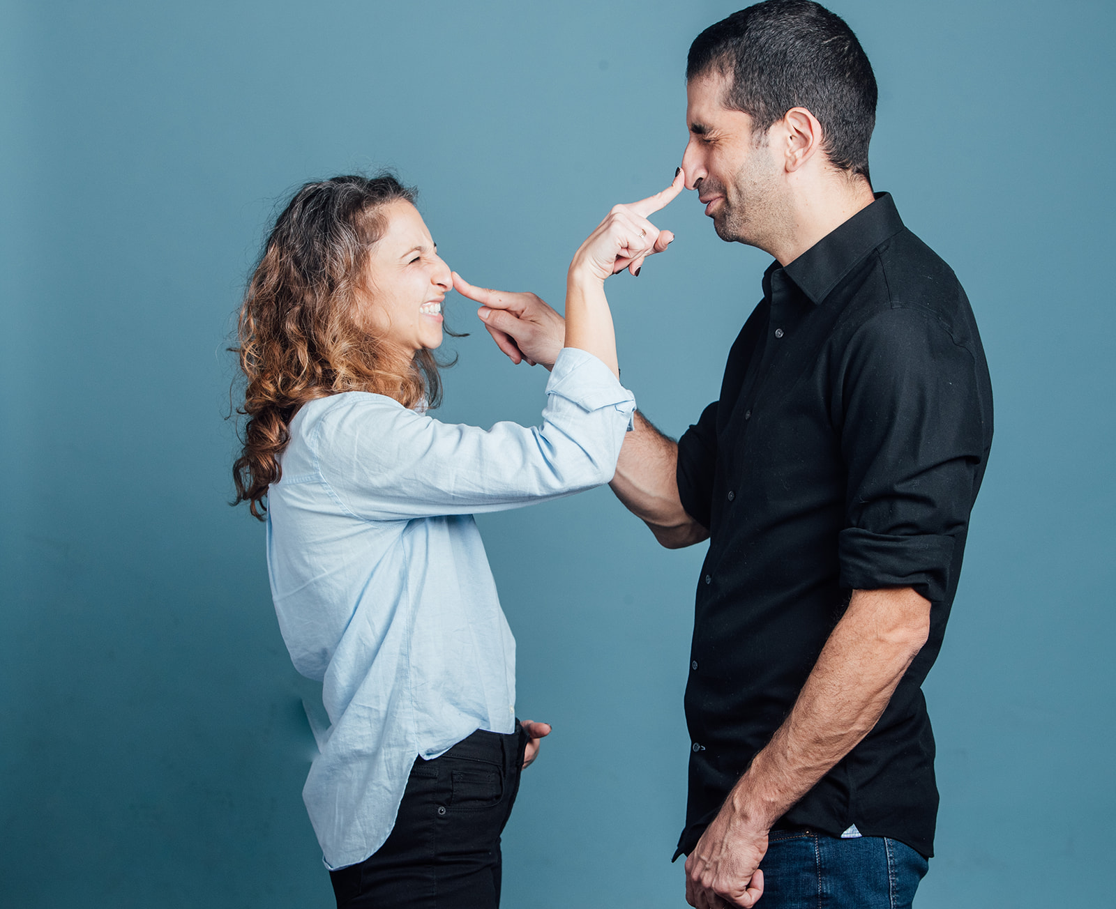 Dr. Assael and Galit Romanelli playfully booping each other's noses