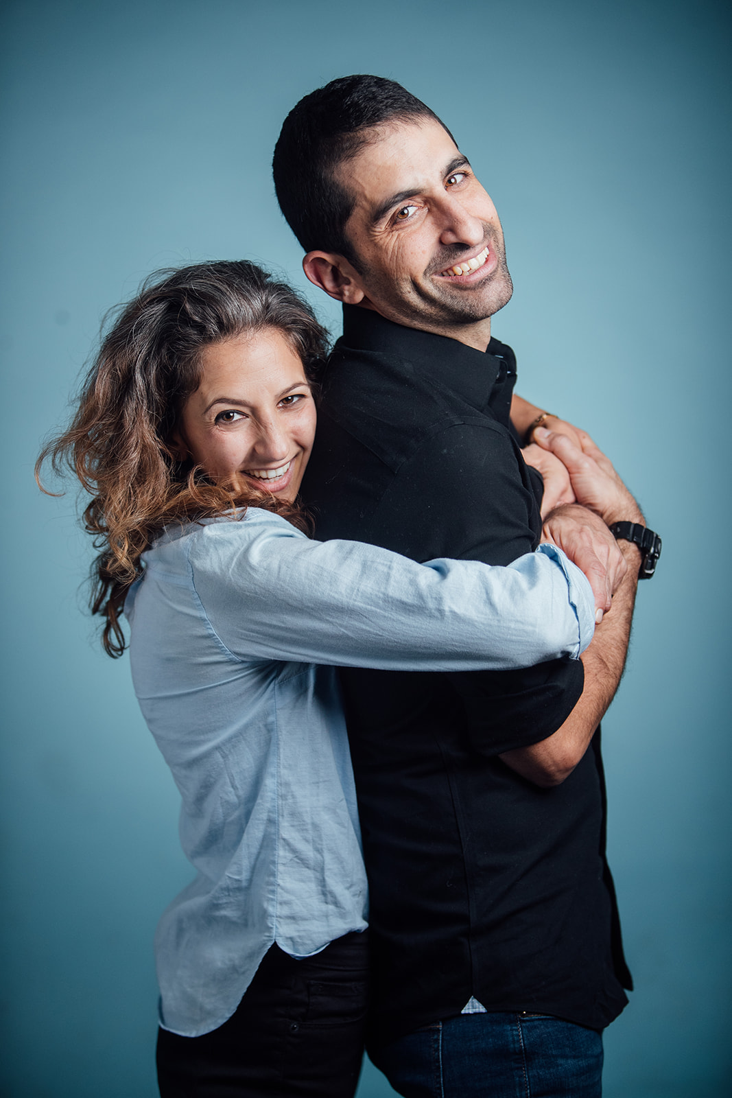 Dr. Assael and Galit Romanelli embracing, smiling at the camera
