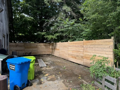 Wooden privacy fence providing a natural aesthetic