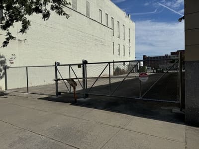 Heavy-duty chain-link fence with a gated entrance