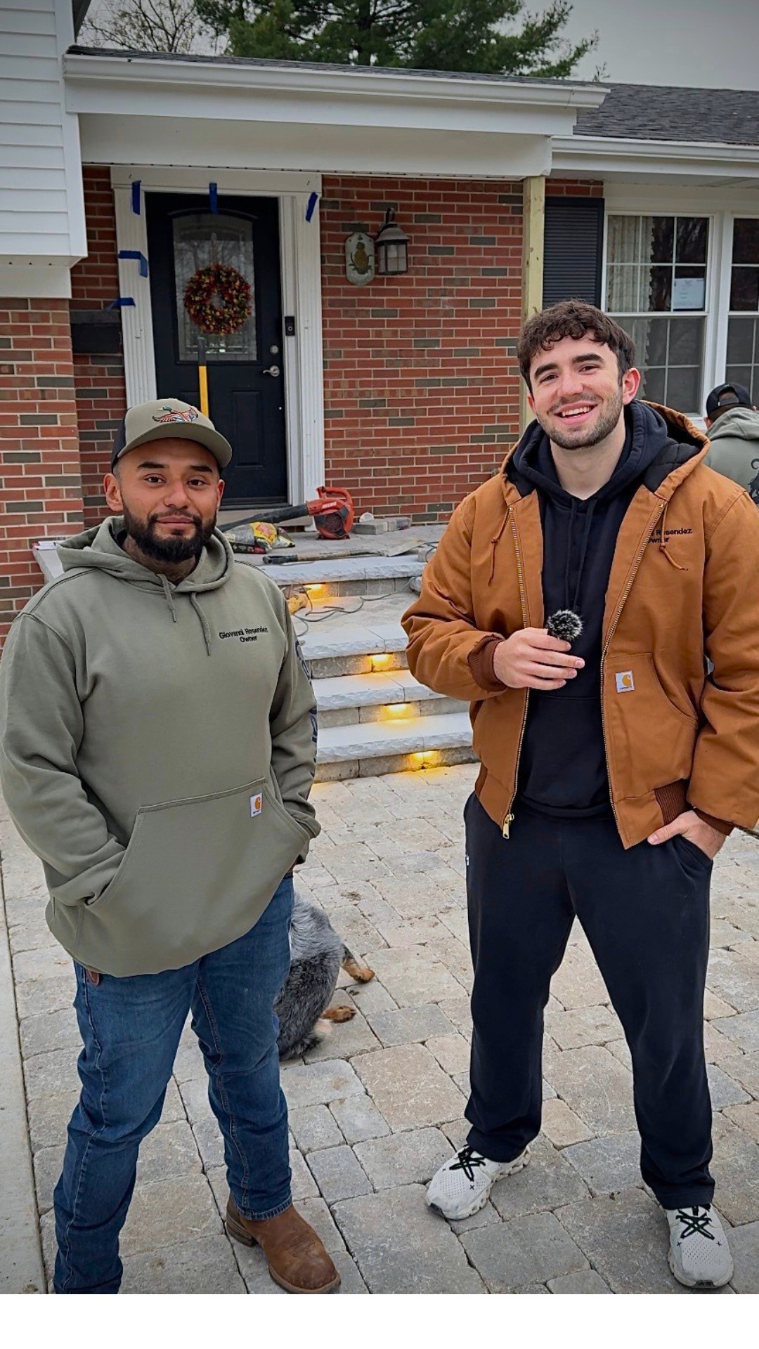 Conrad Bobrowicz with a client on a finished paver job