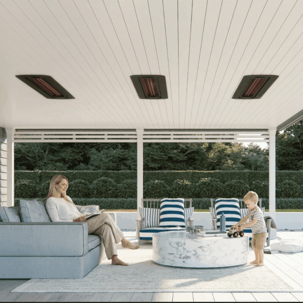 Family enjoying a bright covered porch with Bromic ceiling heaters