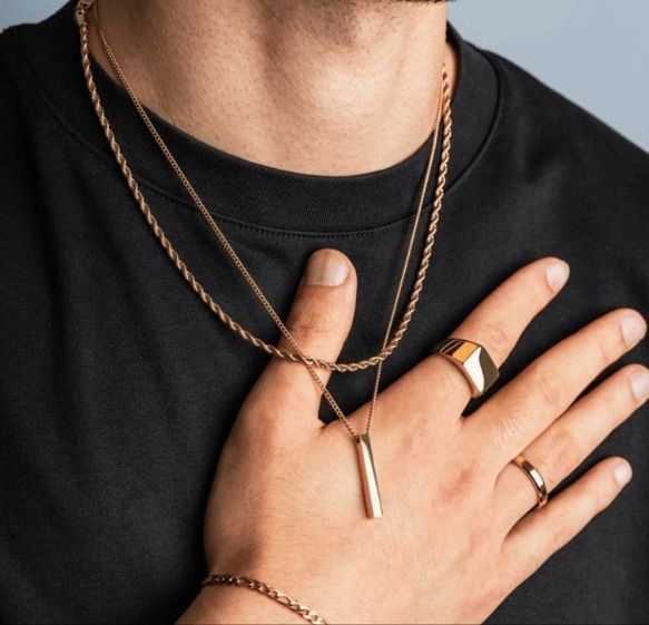 Costa's Fine Jewelry and Coins in Waukesha, WI. Image of a guy wearing necklaces and rings.