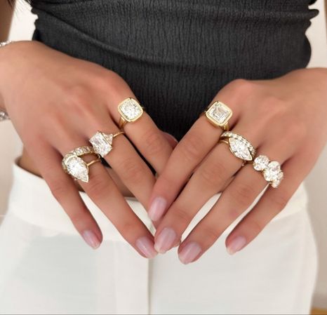 Costa's Fine Jewelry and Coins in Waukesha, WI. Image of a pair of hand wearing jewelries finalizing the transaction.