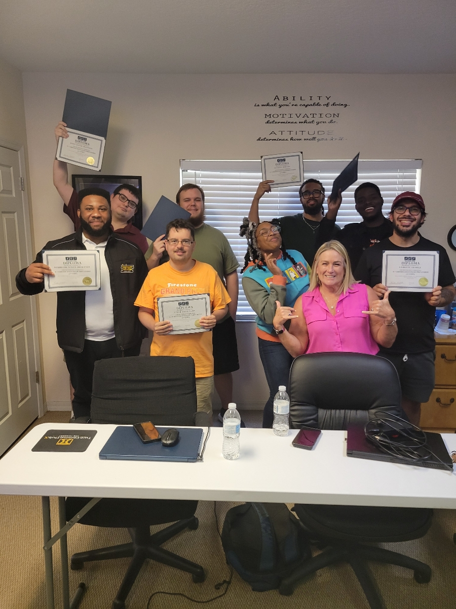 ACT graduating cohort celebrating with founder Kristin Pelletier