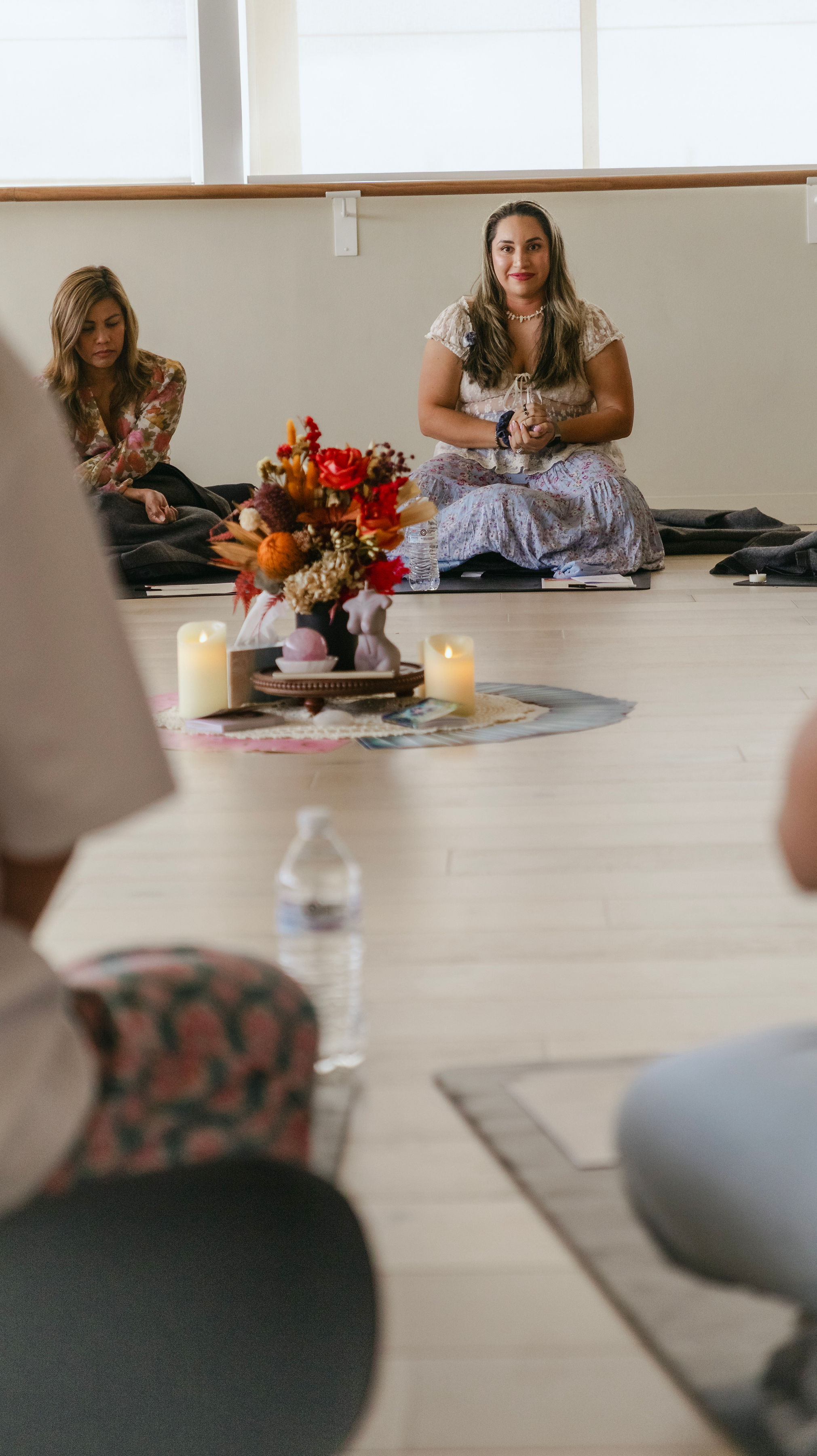 Rosalia talking closely with a woman at The Circle of the Phoenix