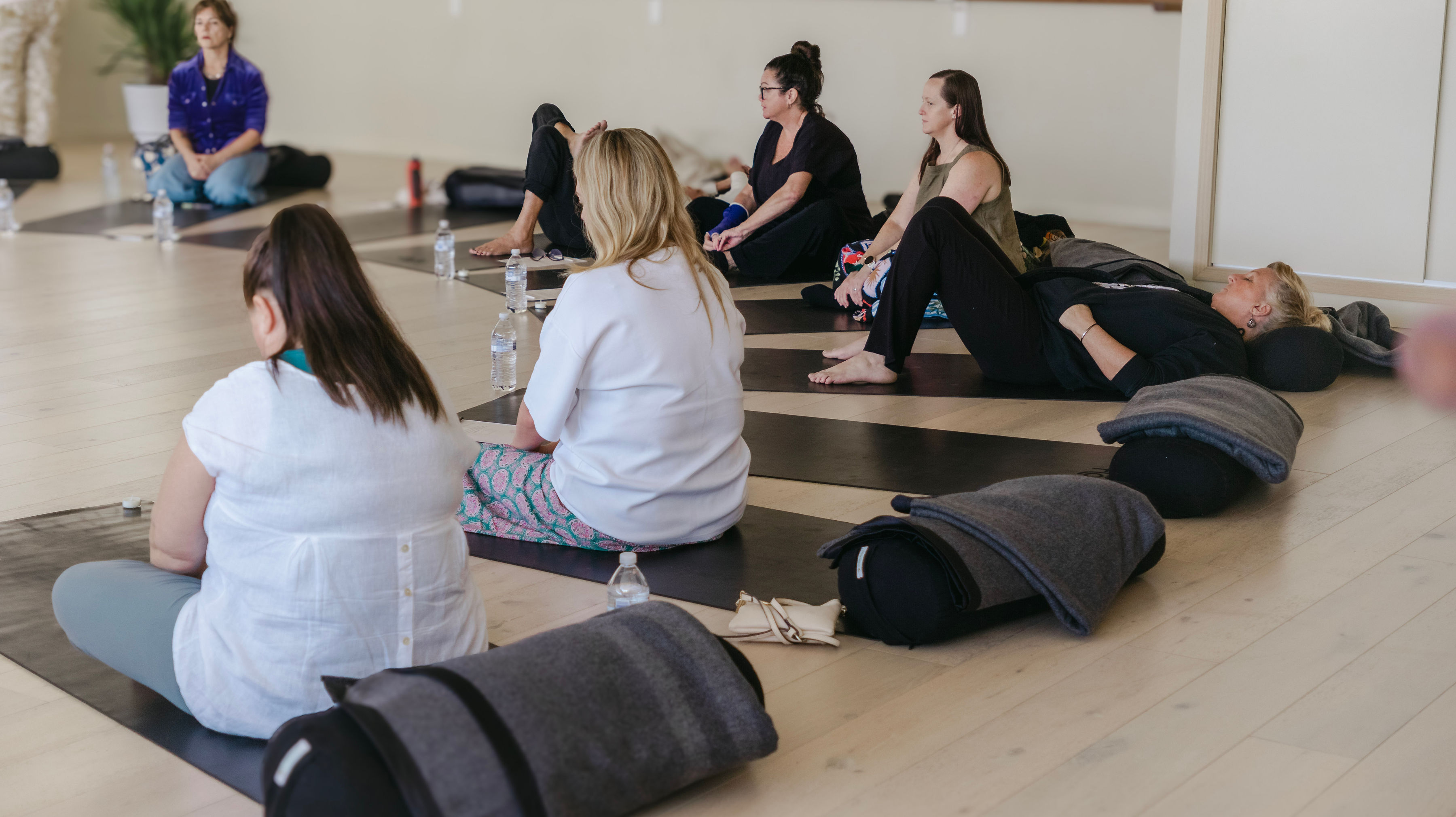 The group settling into stillness during guided rest