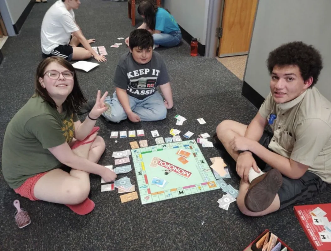 Students playing a board game together