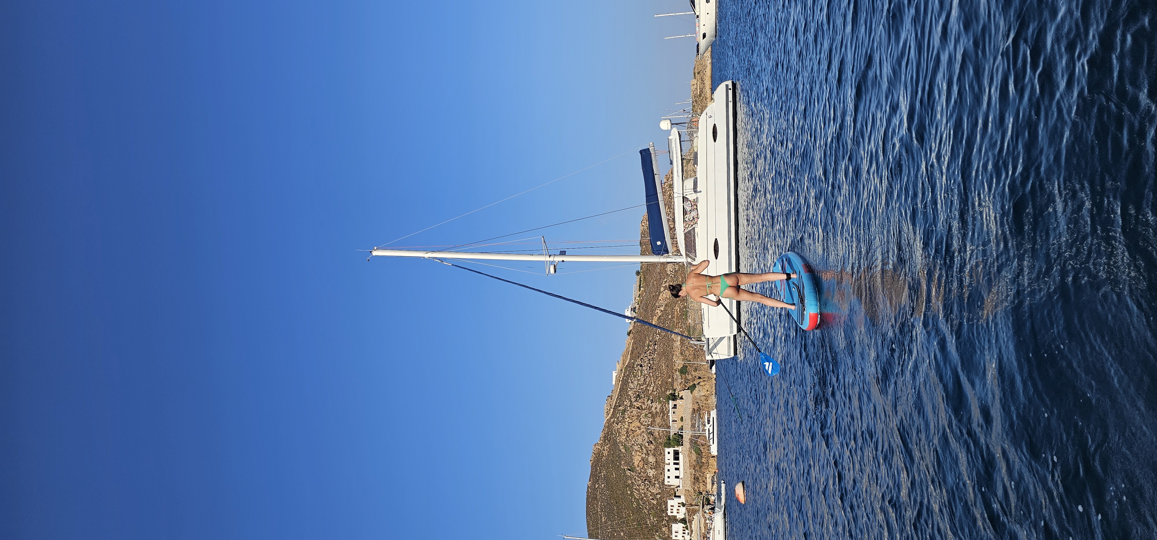 Wakeboarding off the back of the catamaran