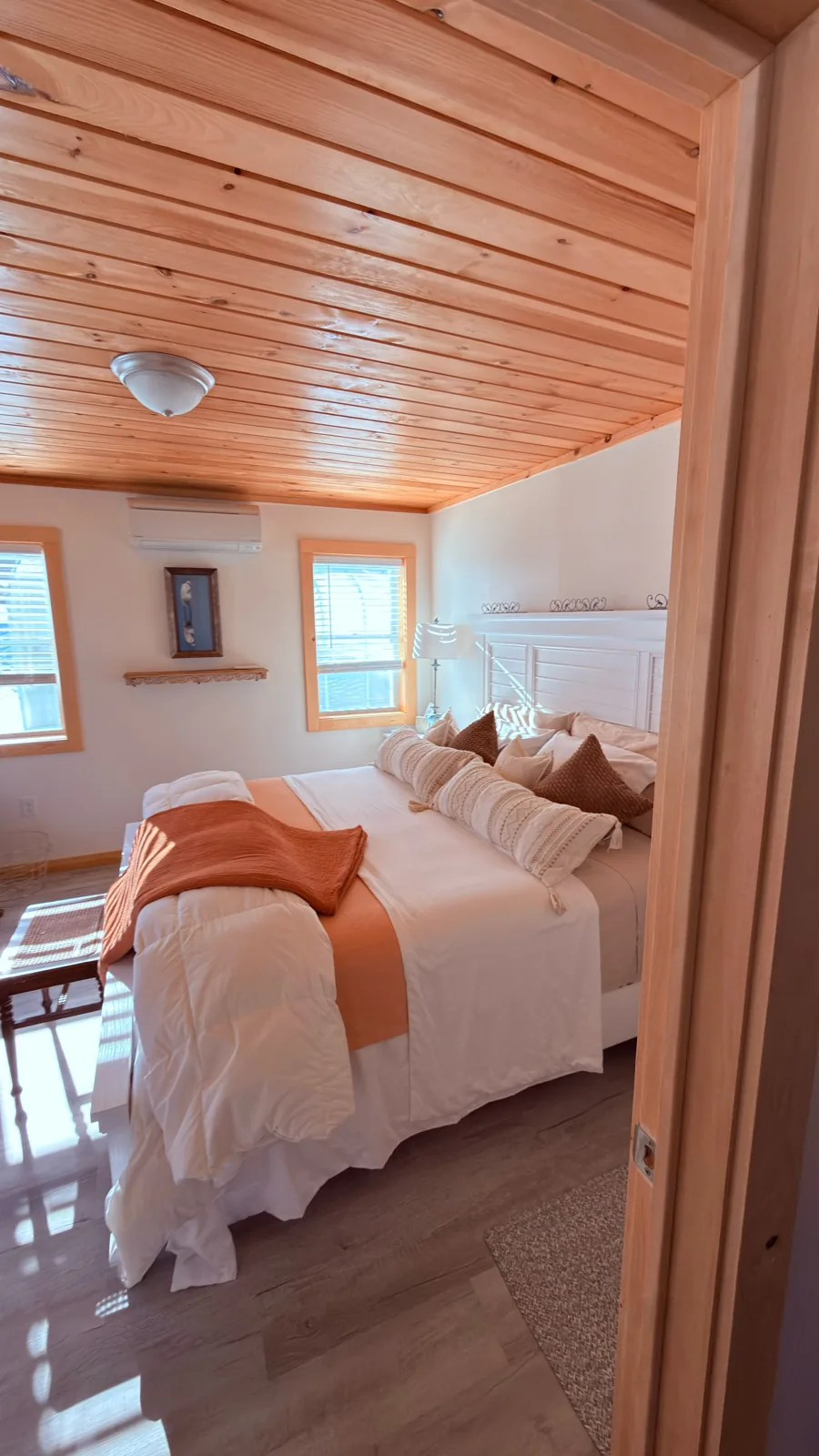 Knotty pine paneled bedroom with new trim
