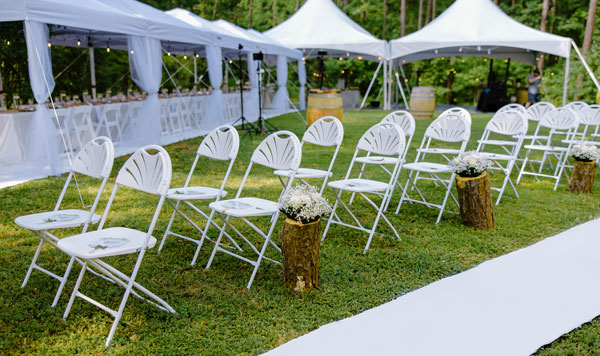 Elegant outdoor tent setup by Joy Event Rentals