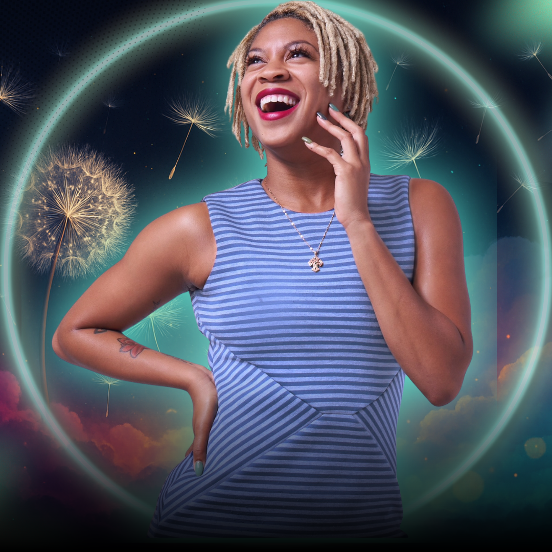 A smiling South Asian woman in her 40s, wearing a teal blouse, seated at a modern desk with a laptop and colorful sticky notes. The setting is a bright, organized workspace, radiating warmth and expertise.