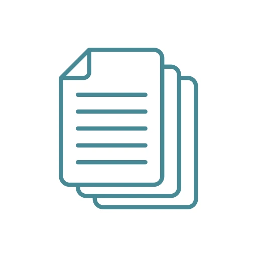 Stack of important documents being reviewed and organized on a desk with a laptop and pen nearby for reference.