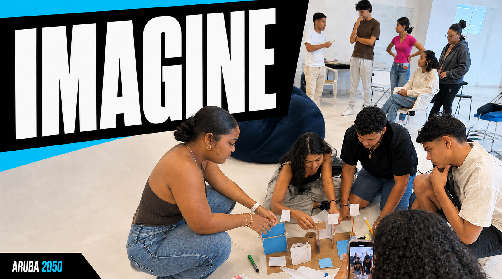 Imagine. Young Arubans building a prototype together on the floor while one films it.
