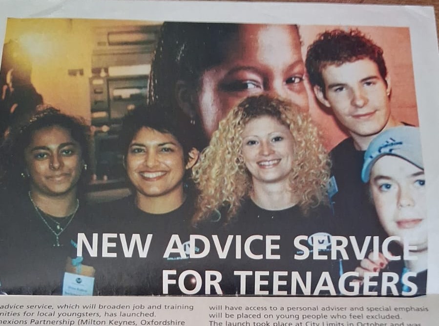 Photograph of an article in a local paper from 2002 with a photograph of a group pof people including Sabrina and the title 'New advisce service for teenagers'