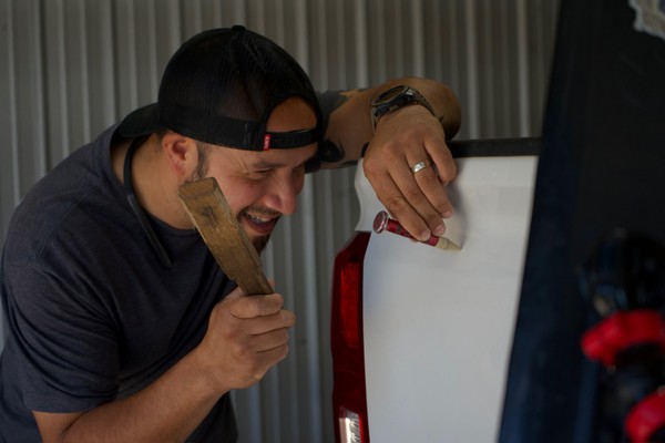 Paintless dent repair before and after vehicle panel