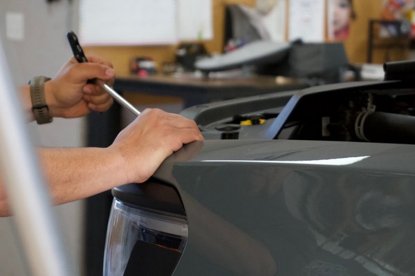 Paintless dent repair before and after vehicle panel