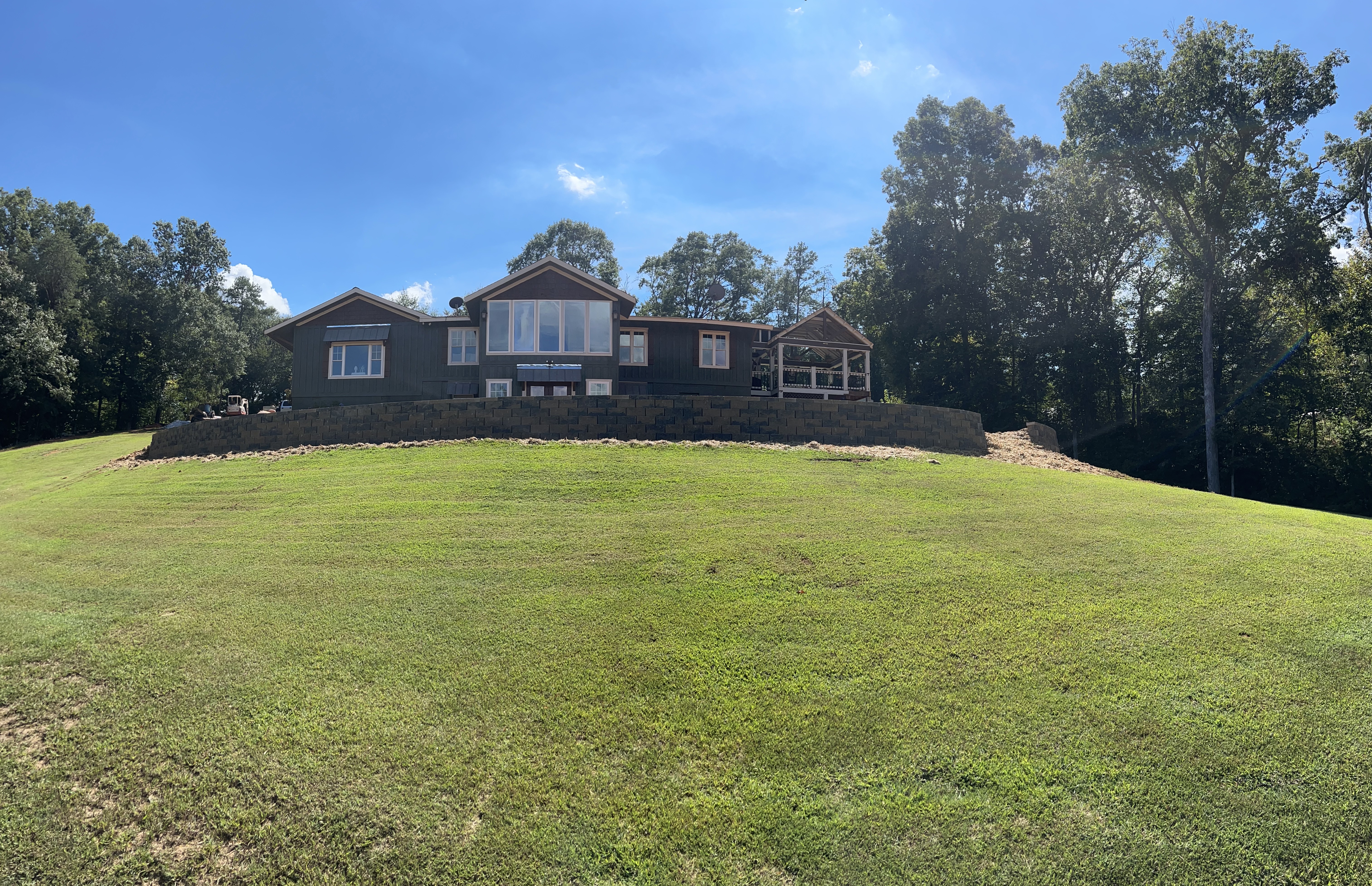 Finished retaining wall with the yard graded around it