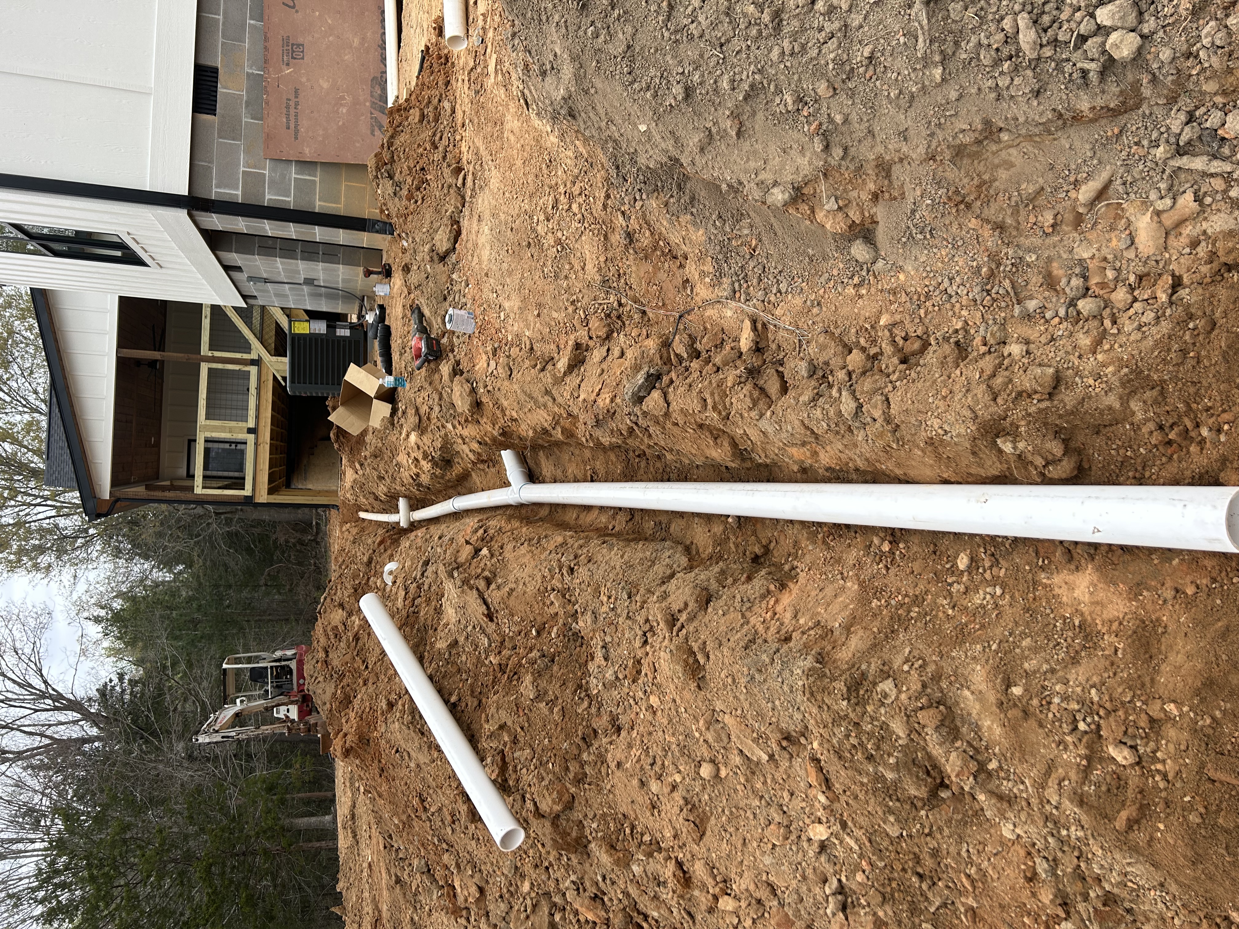 Utility trenching drain line