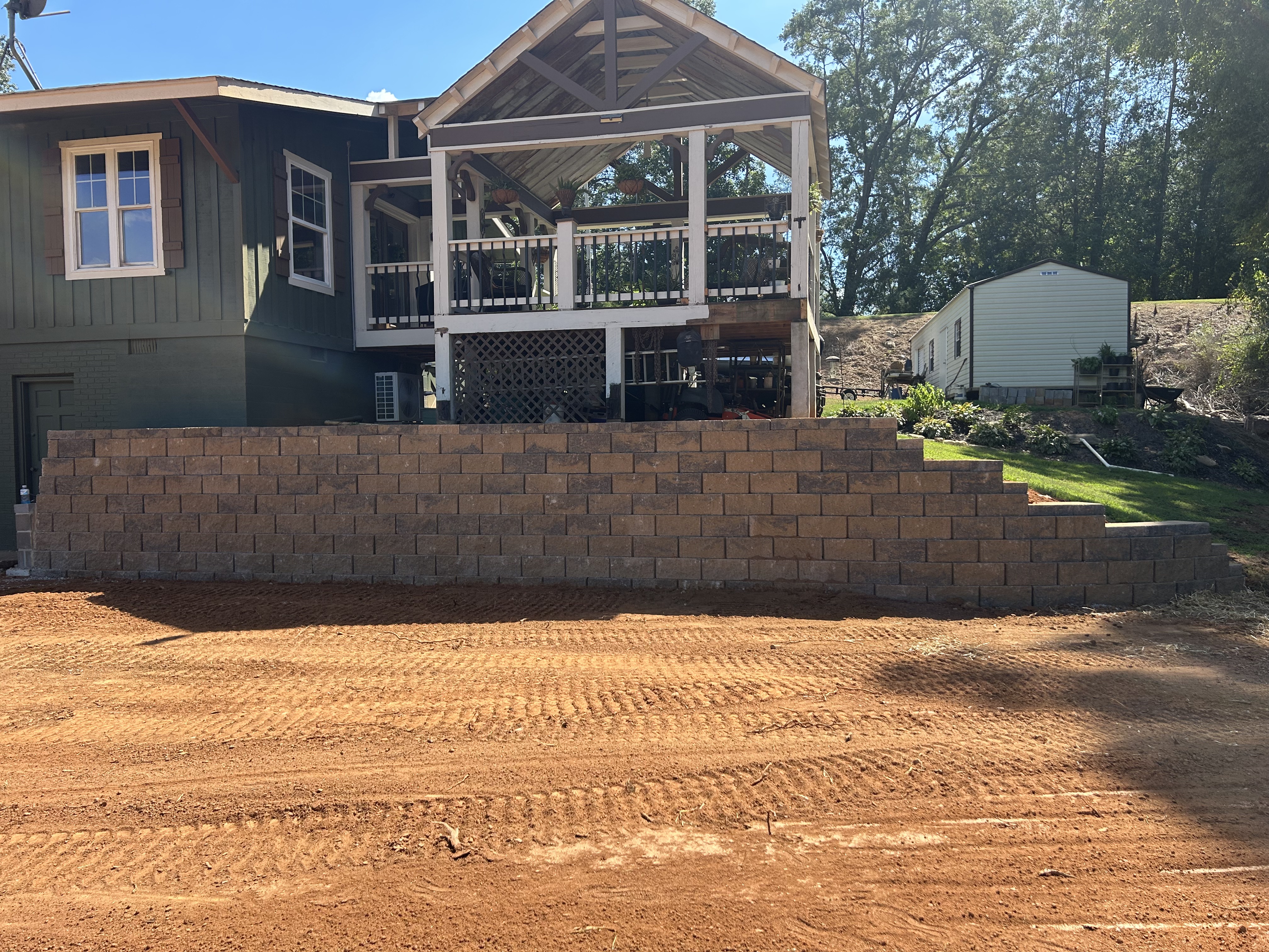 Graded yard behind a retaining wall