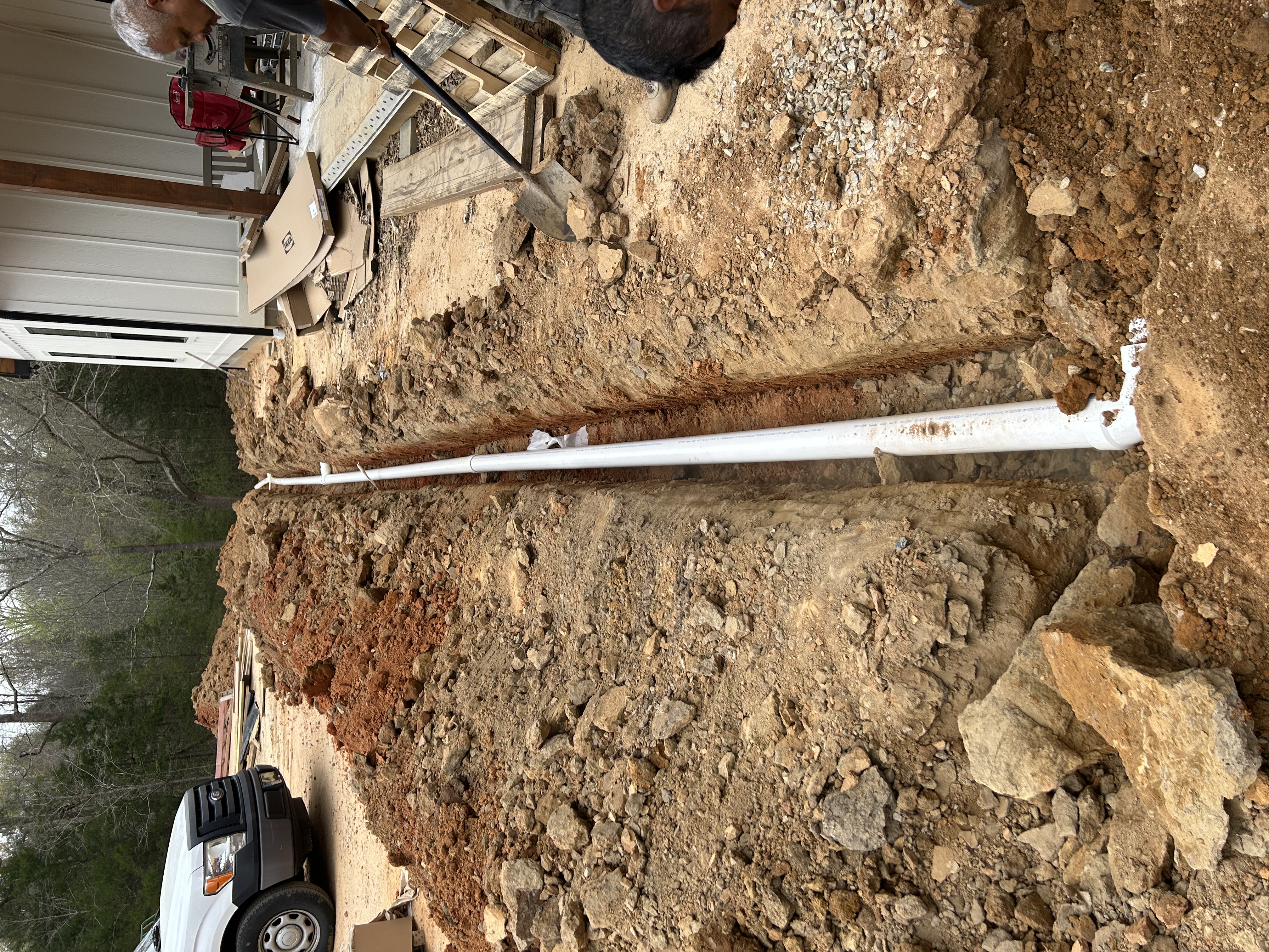 Utility trenching drain line