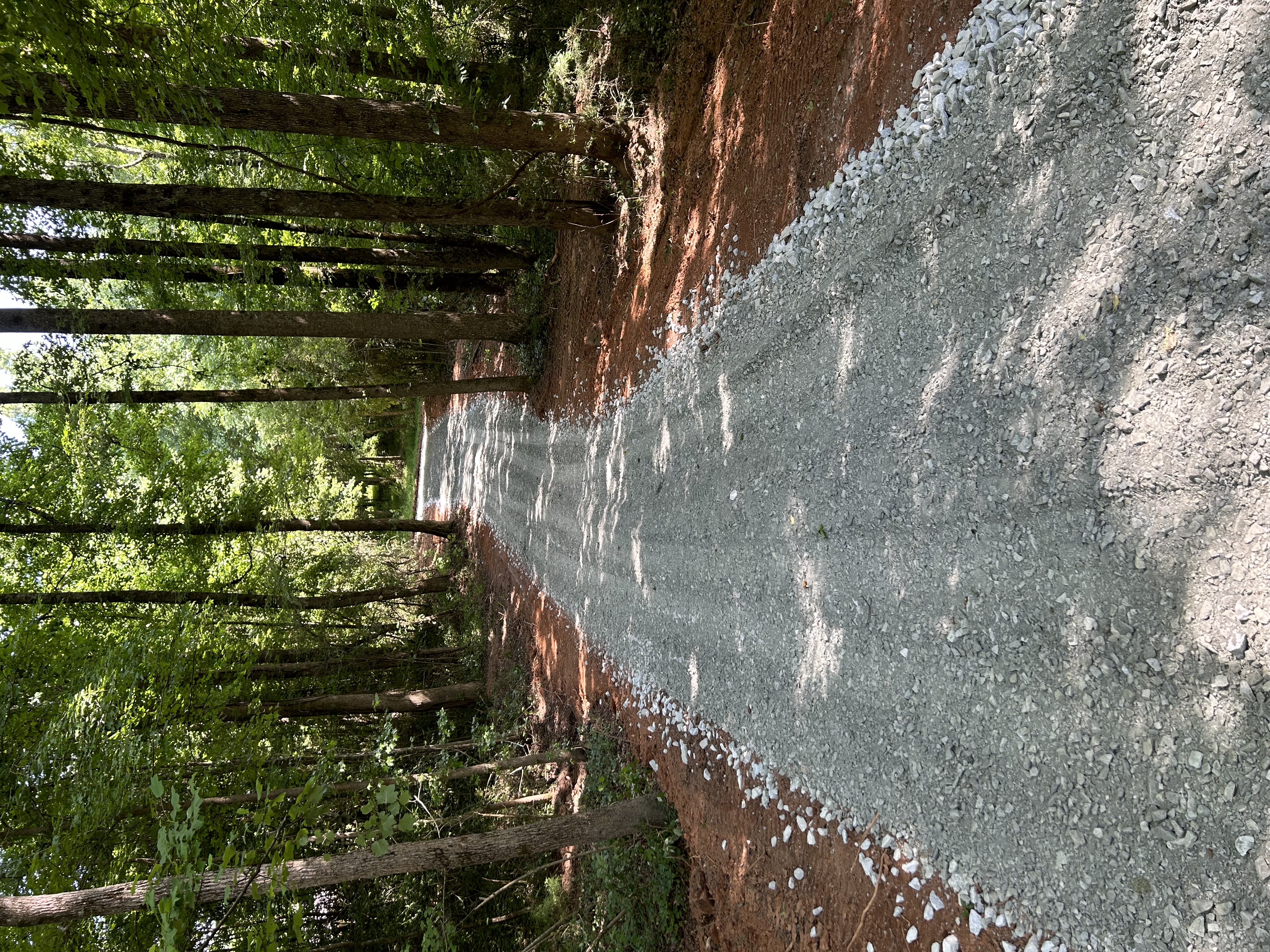 New gravel driveway wooded lot