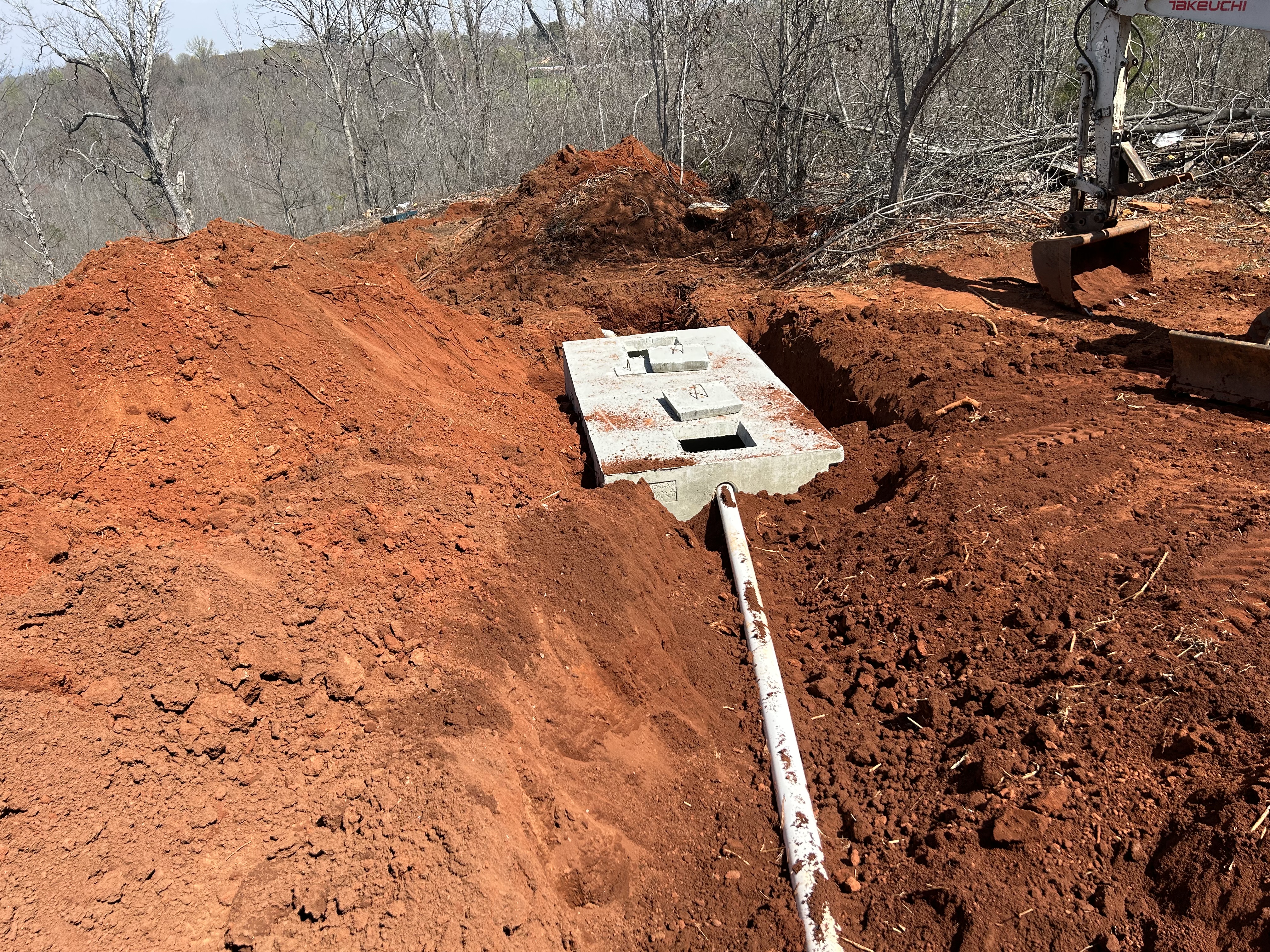 Septic tank being set in the ground