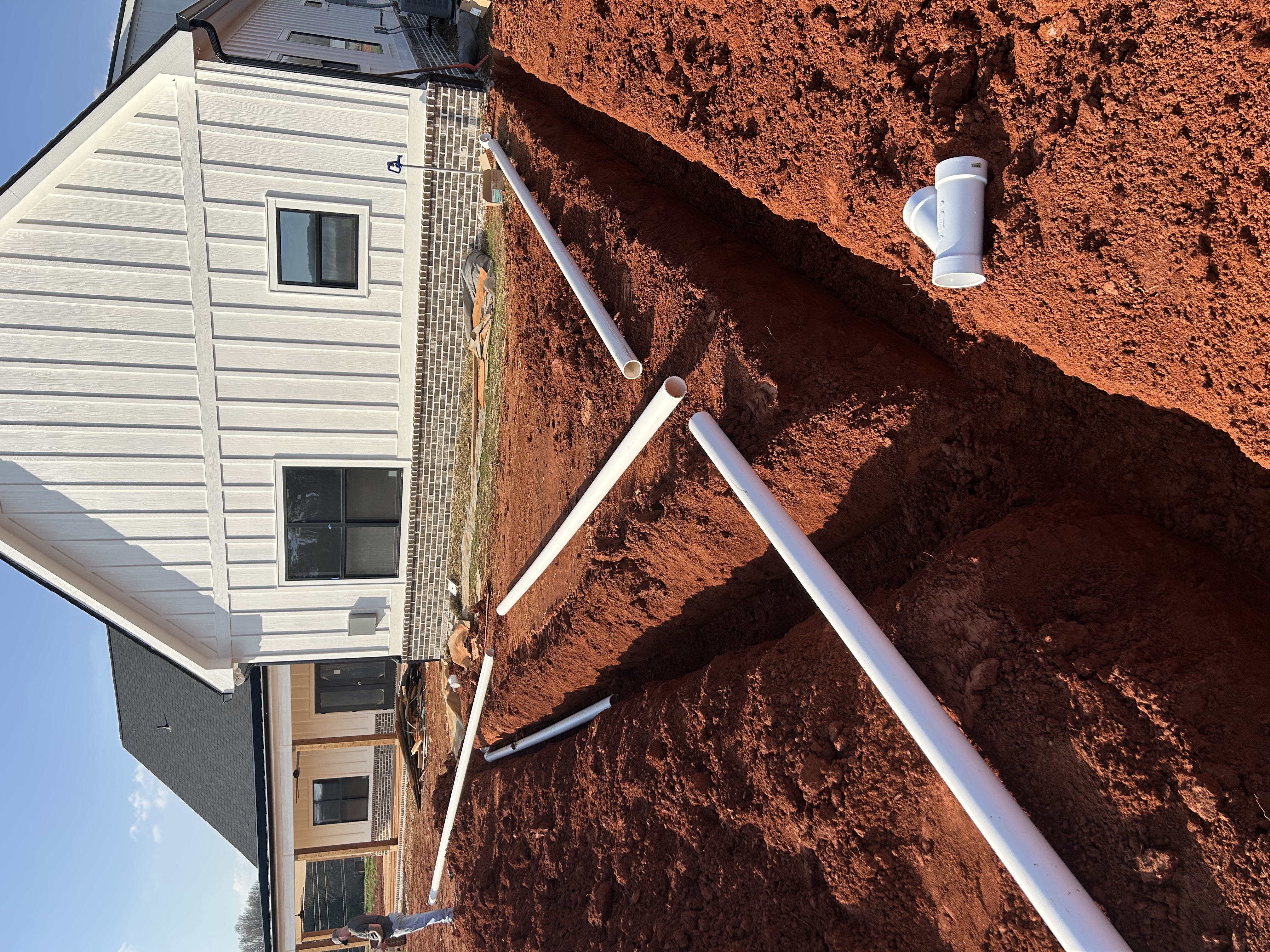 Utility trenching drain lines