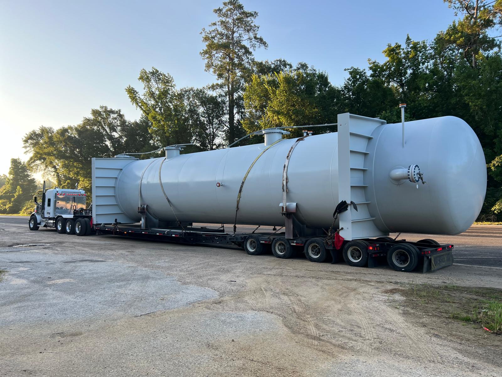 Heavy haul truck moving over-dimensional freight at dusk