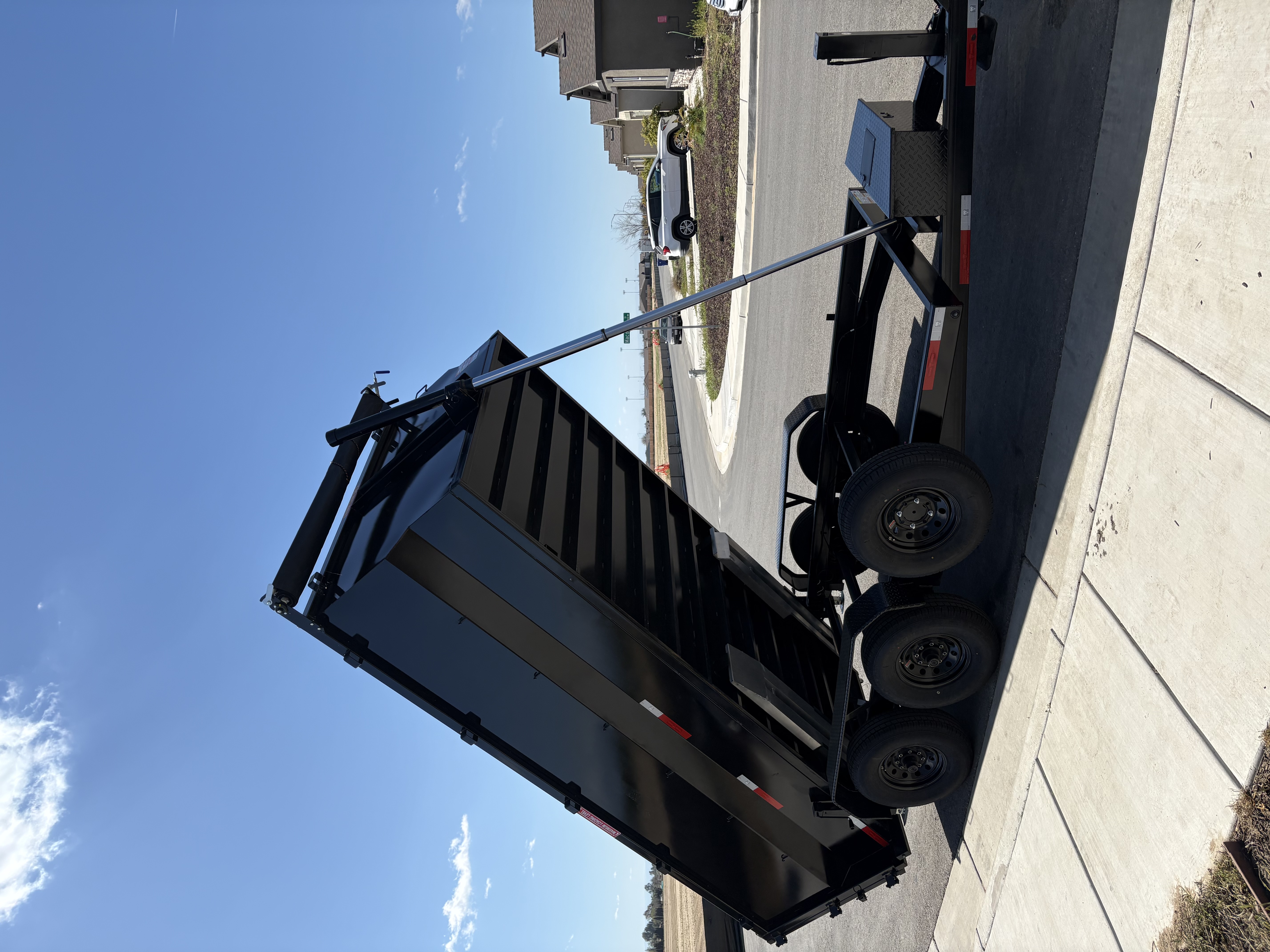 Dump trailer and car hauler on the lot at Bako Junkers and Trailers in Bakersfield, CA