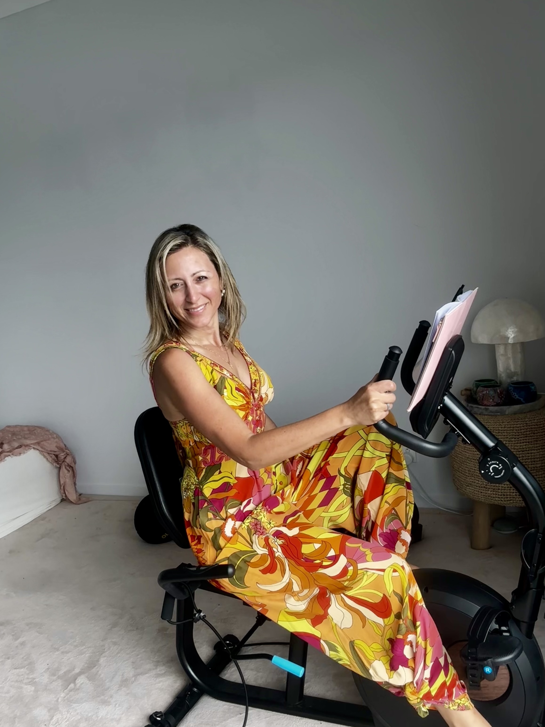 Vicky Samios seated on her exercise bike, full photograph