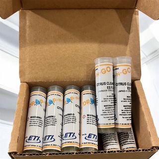 Open box of compact Drop N Go citrus cleaner refill cartridges for easy storage