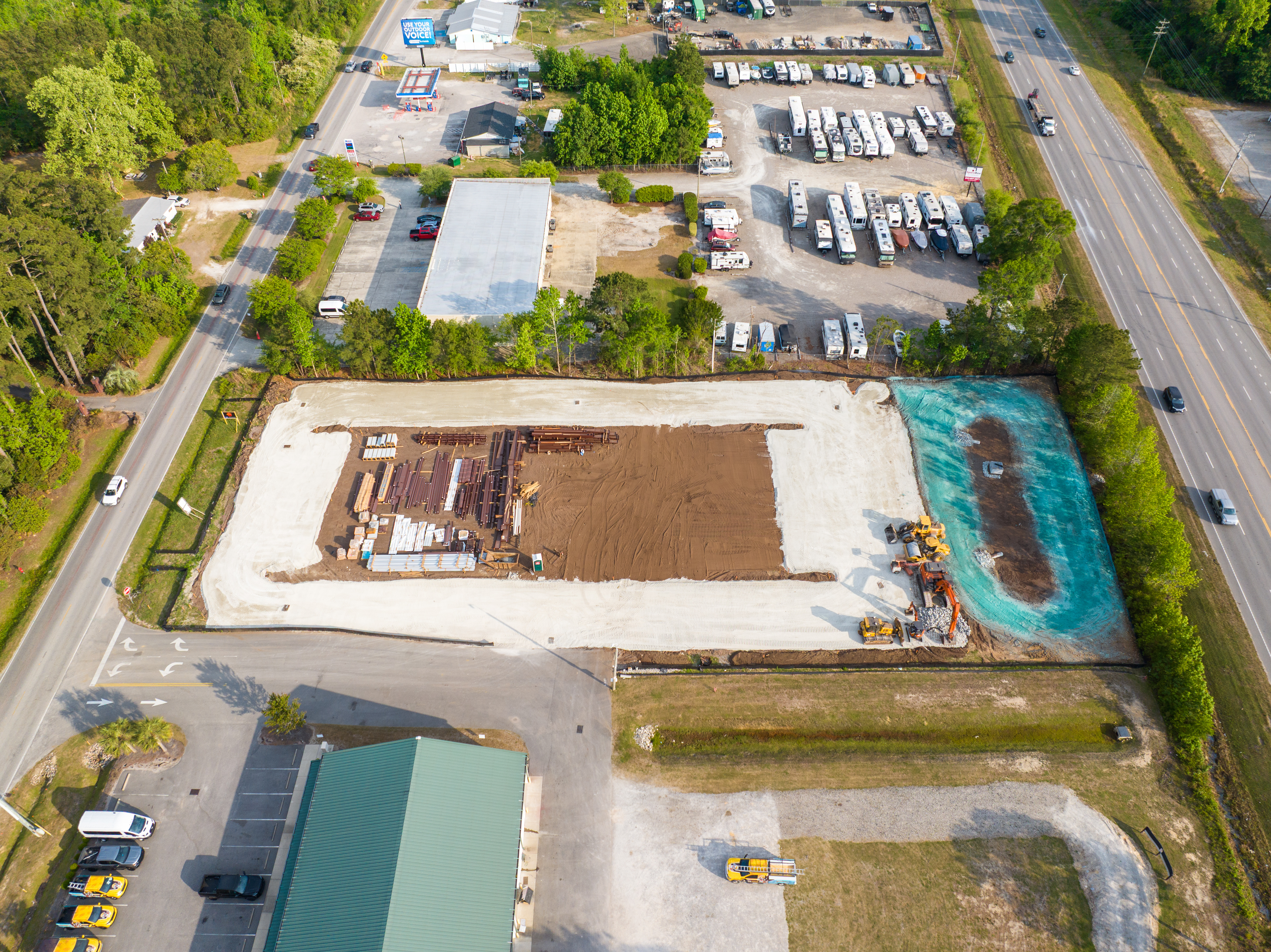 Aerial overview of construction site and surrounding area