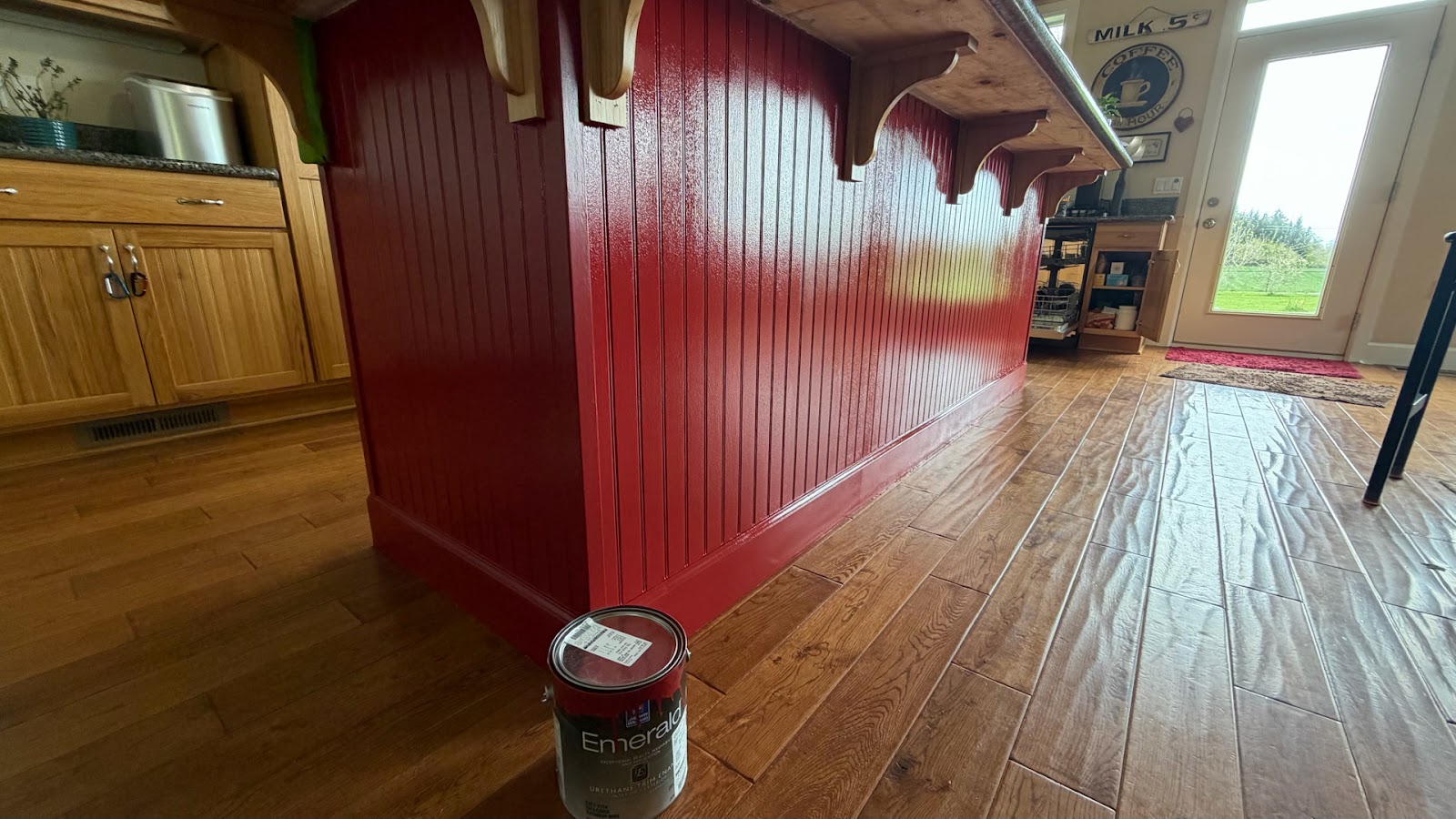 Painted red kitchen island in a remodeled kitchen