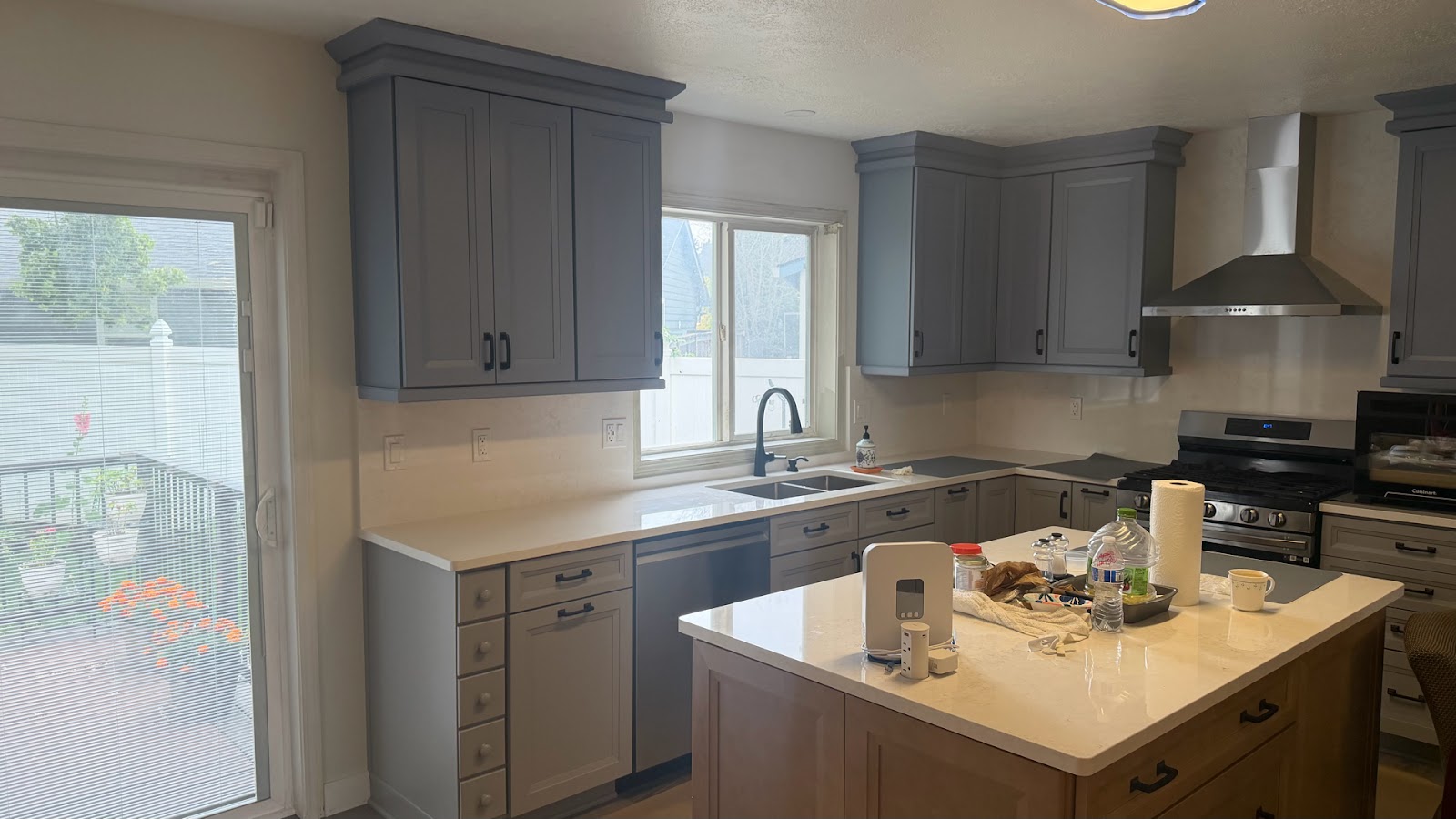 Finished kitchen remodel with updated cabinetry, counters, and freshly painted walls coordinated by one team