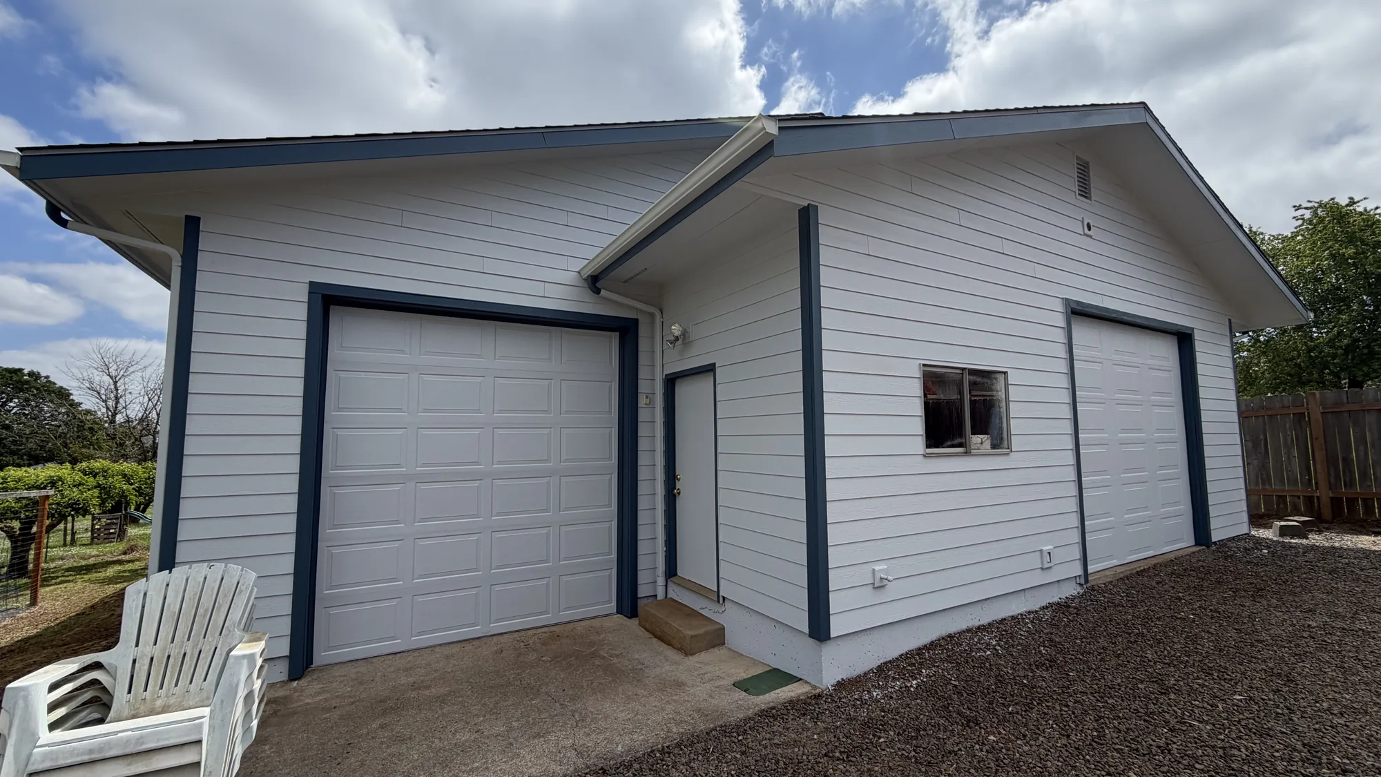 White garage exterior after professional exterior painting